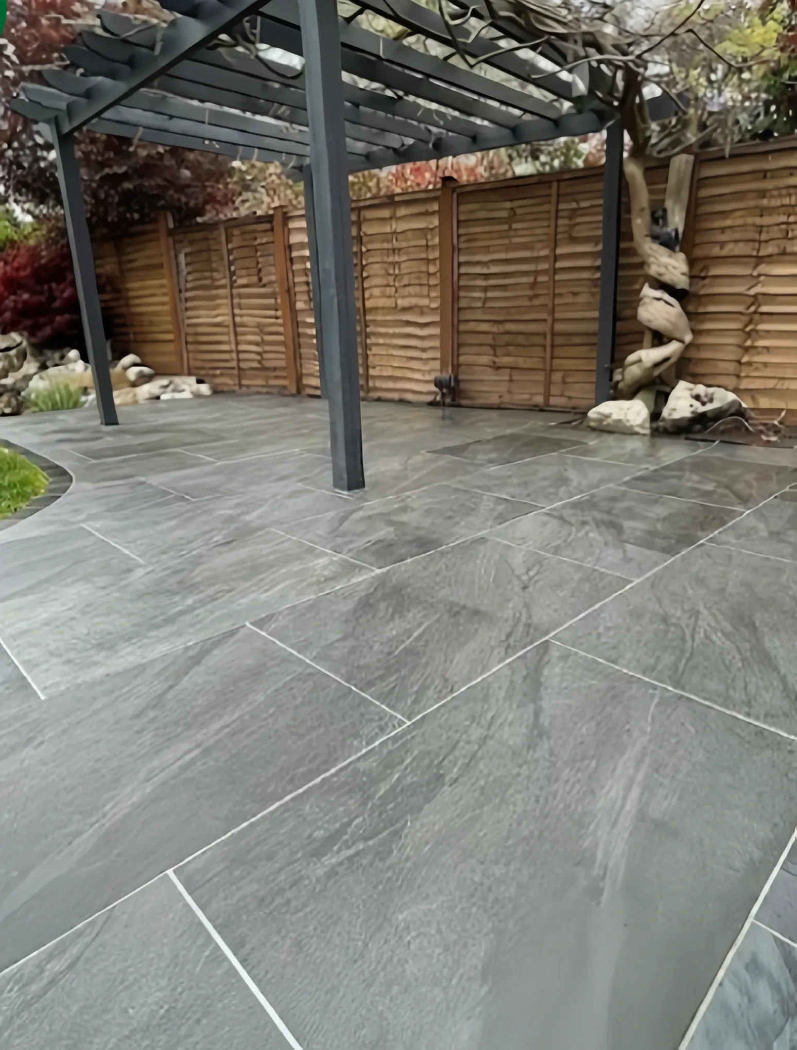 Charcoal porcelain patio pergola by Heritage