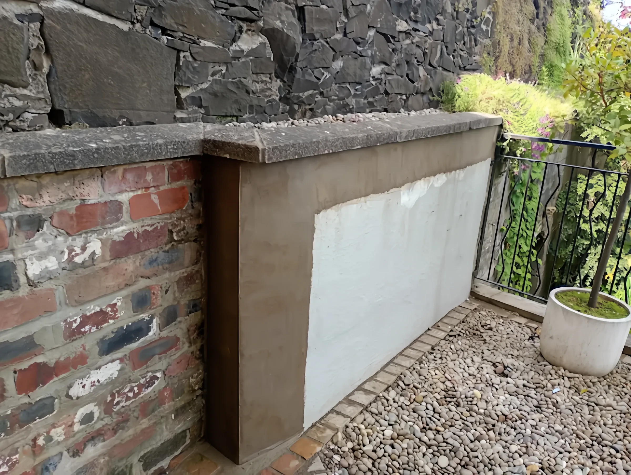 Rendered stone retaining wall by Heritage